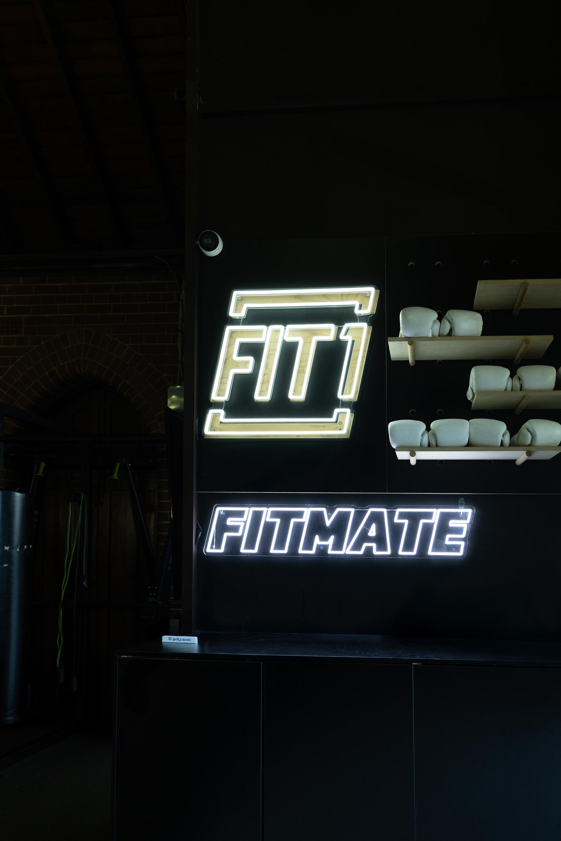 Person stretching in a fitness pose with dramatic lighting