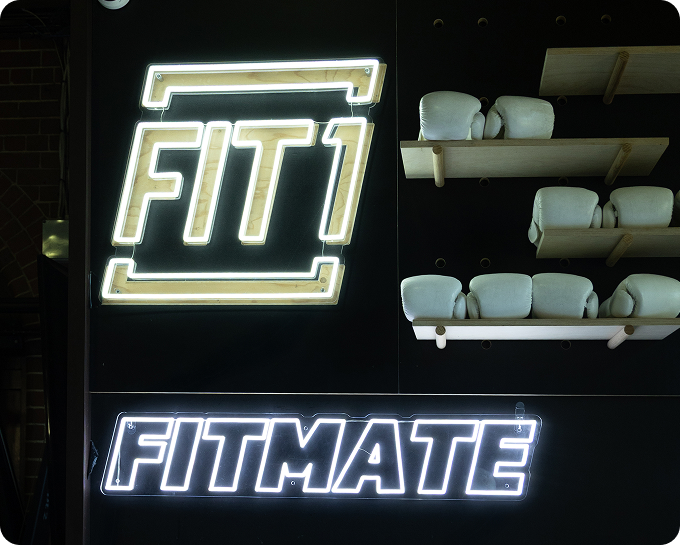 Person stretching in a fitness pose with dramatic lighting