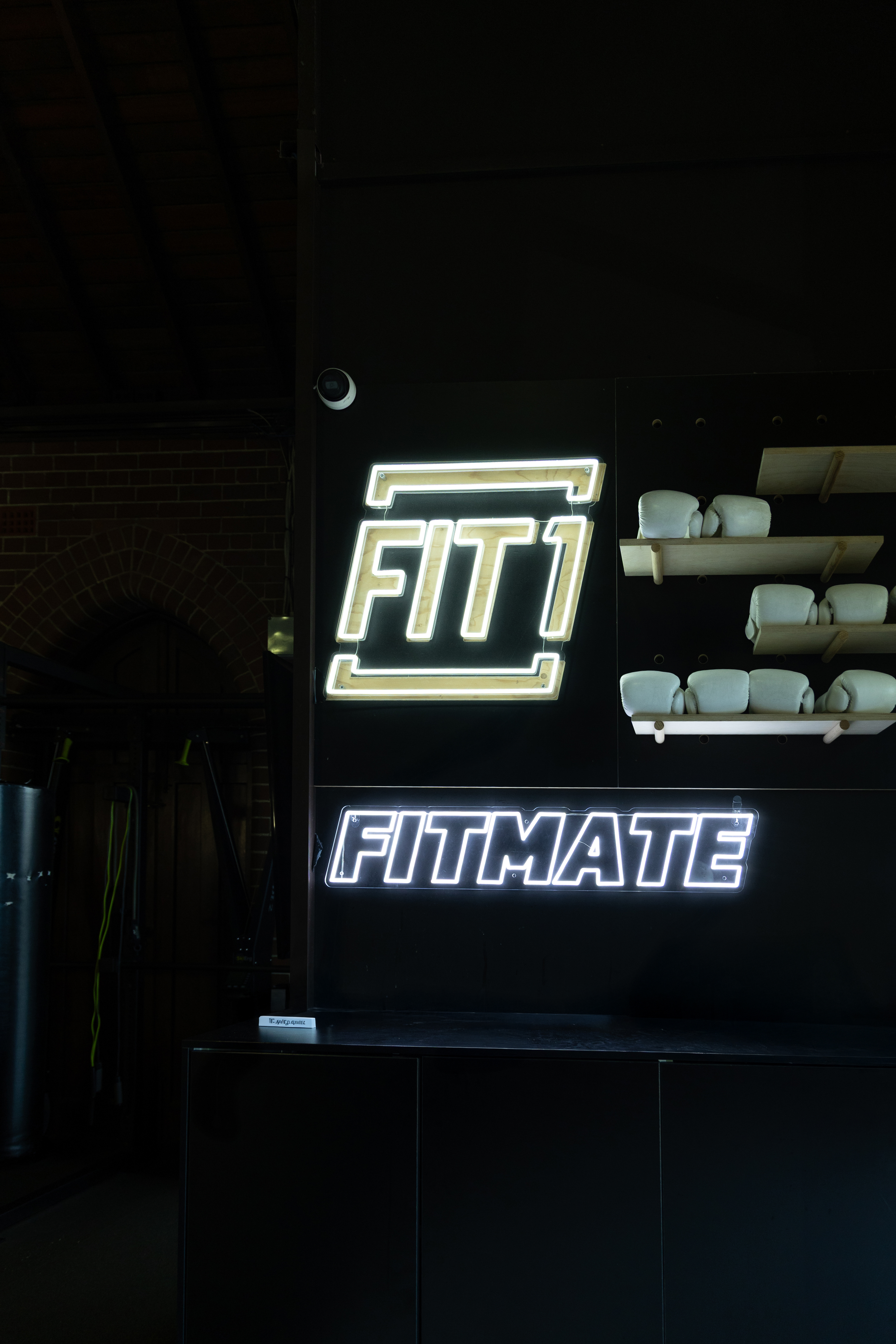 Person stretching in a fitness pose with dramatic lighting